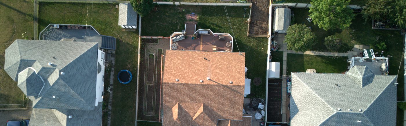 Capture — a surveyor operating a drone on site, wide landscape crop